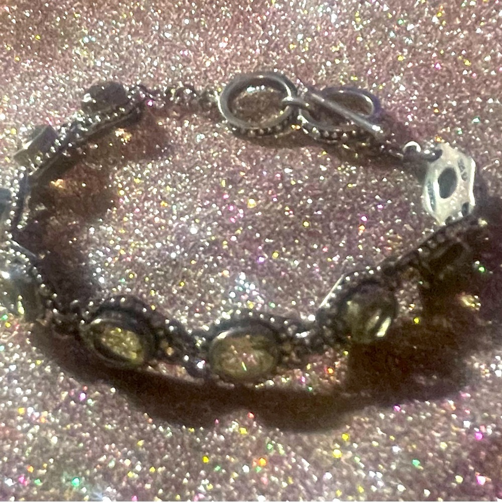 925 bracelet with light green stones.